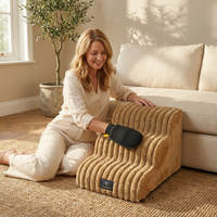 Woman using a pet heating pad in a cozy living room.